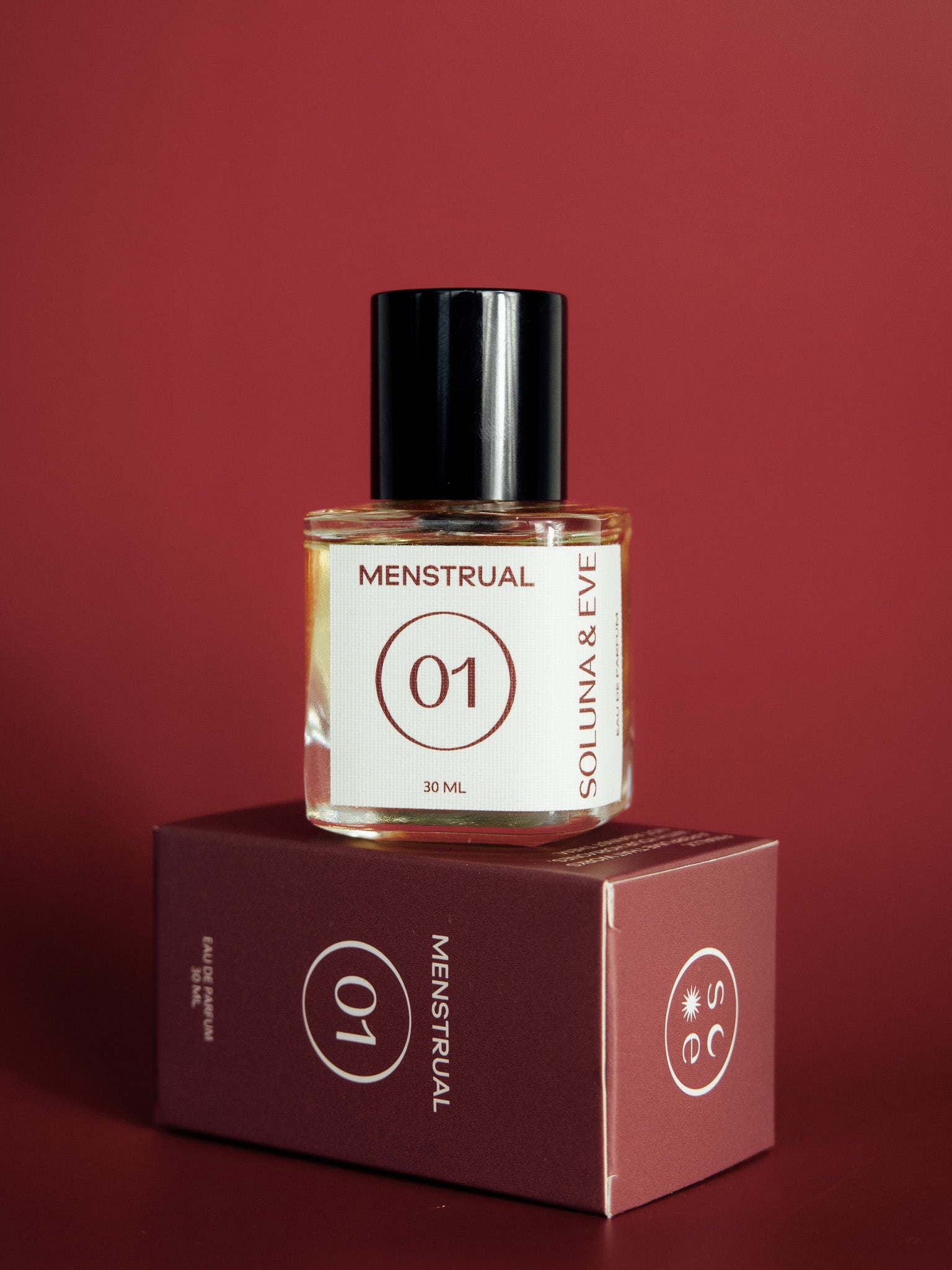 Soluna and Eve menstrual cycle-syncing perfume bottle on white background